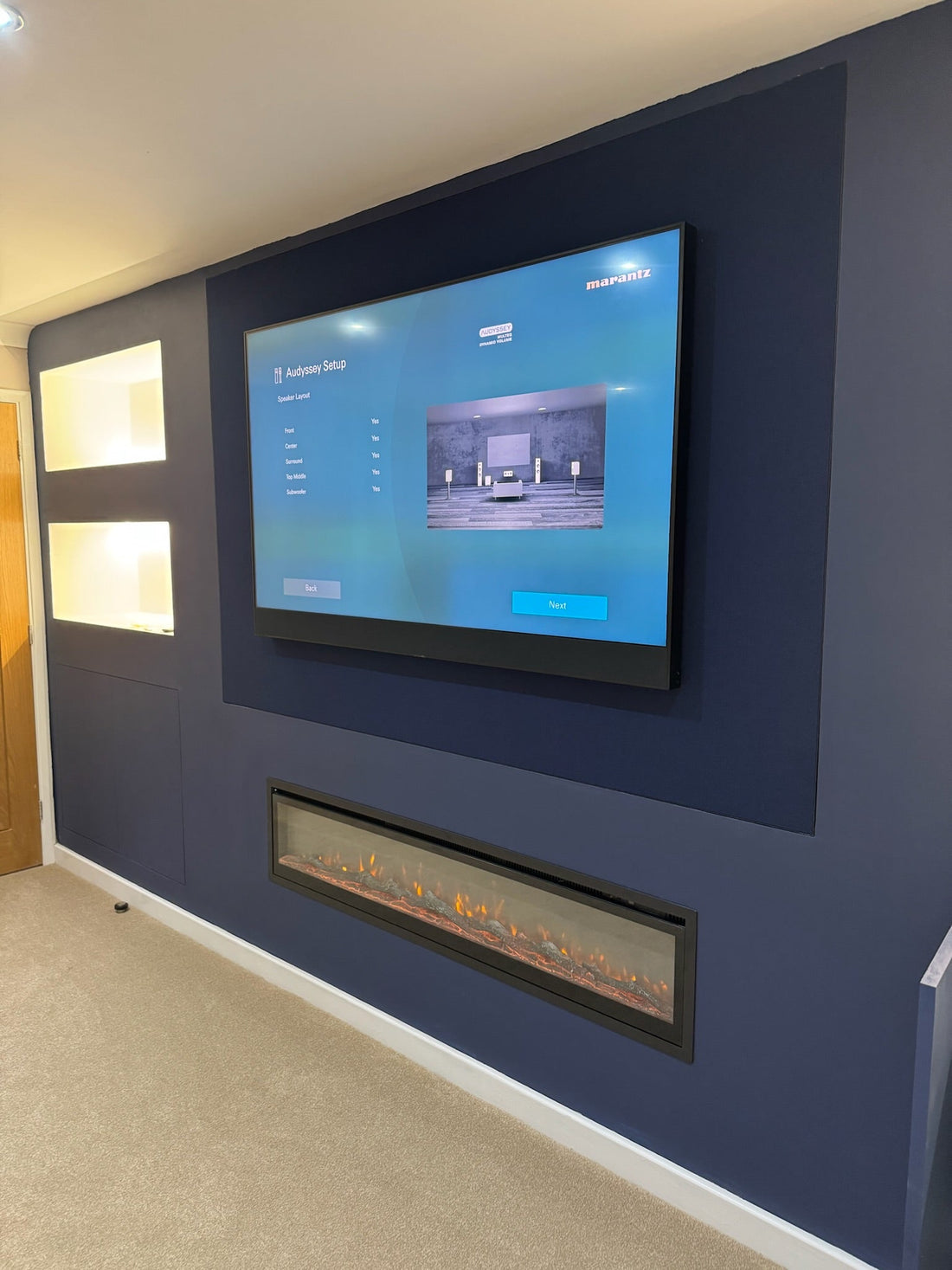 Media Wall Installation with hidden cinema Roche Emotive AV